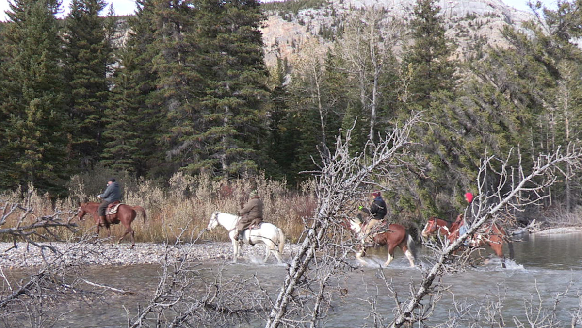 Special Still: Crossing river on horseback