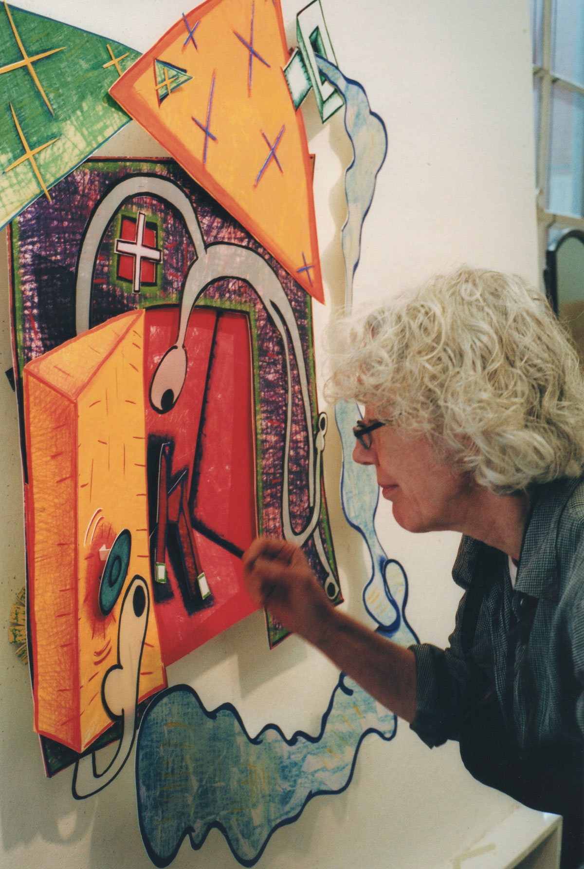 Elizabeth Murray painting in her studio